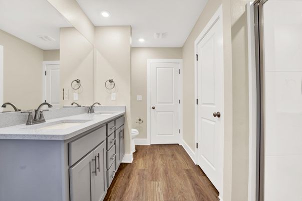 Bathroom, Dual Sink Vanities, Interior, Recessed Lighting, Wood Texture Flooring