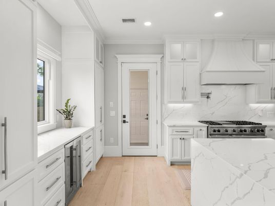 Interior, Kitchen, Marble Walls, Recessed Lighting, Stainless Steel Appliances, Wood Texture Flooring