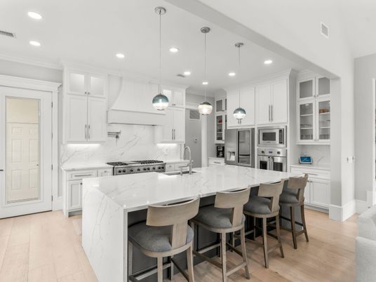 Interior, Kitchen, Marble Walls, Pendant Lights, Recessed Lighting, Stainless Steel Appliances, Wood Texture Flooring