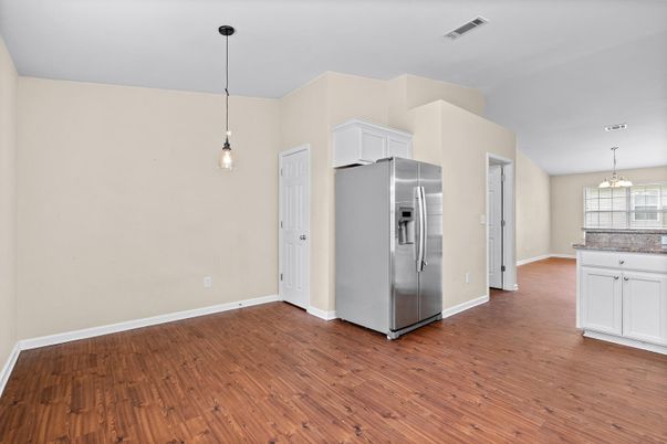 Empty room, Interior, Kitchen, Pendant Lights, Stainless Steel Appliances, Wood Texture Flooring