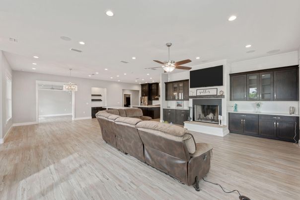 Chandelier, Fireplace, Interior, Living room, Recessed Lighting, Wood Texture Flooring