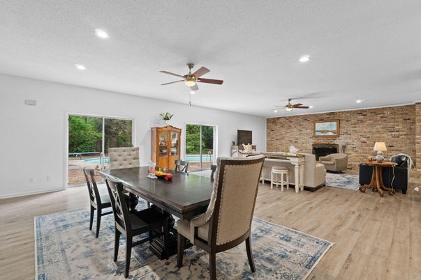 Dining room, Interior, Living room, Recessed Lighting, Stone Walls, Wood Texture Flooring