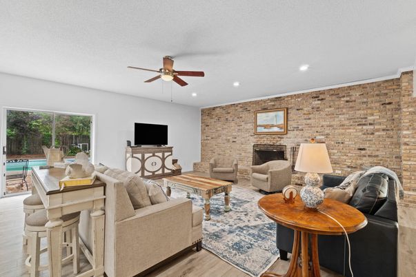 Fireplace, Interior, Living room, Recessed Lighting, Stone Walls, Wood Texture Flooring