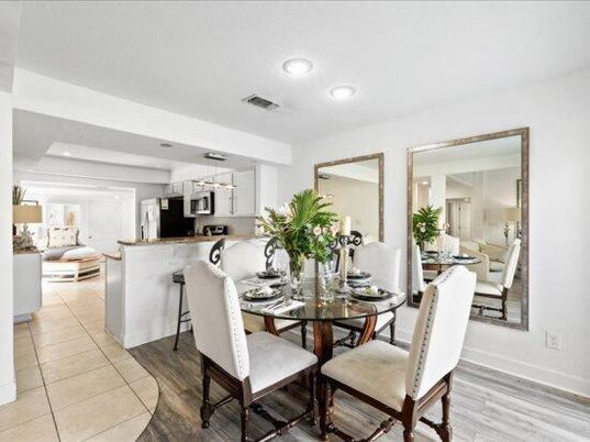 Chandelier, Dining room, Interior, Kitchen, Living room, Pendant Lights, Recessed Lighting, Stainless Steel Appliances, Wood Texture Flooring