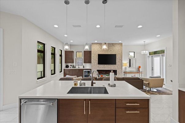 Fireplace, Interior, Kitchen, Living room, Pendant Lights, Recessed Lighting, Stainless Steel Appliances, Stone Walls