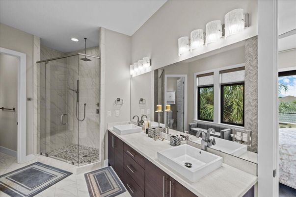Bathroom, Dual Sink Vanities, Glass Shower, Interior, Marble, Marble Walls, Recessed Lighting