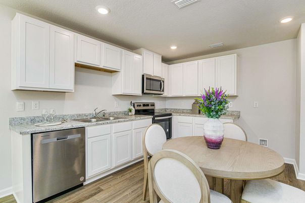 Dining room, Interior, Kitchen, Recessed Lighting, Stainless Steel Appliances, Wood Texture Flooring