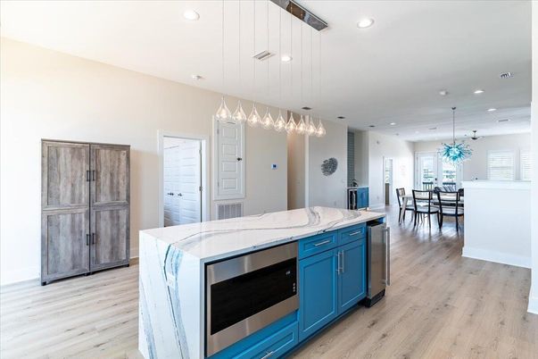 Dining room, Interior, Kitchen, Pendant Lights, Recessed Lighting, Stainless Steel Appliances, Wood Texture Flooring