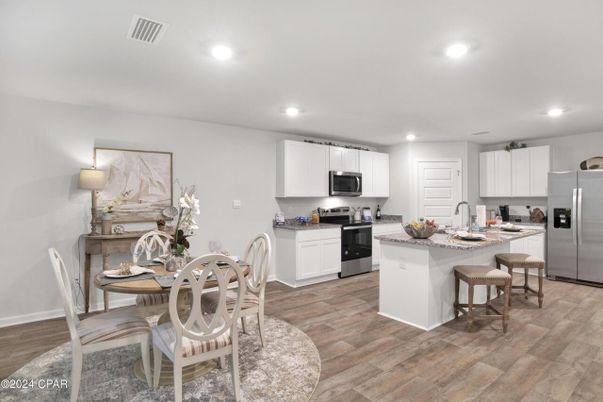 Dining room, Interior, Kitchen, Recessed Lighting, Stainless Steel Appliances, Wood Texture Flooring