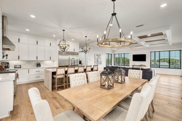 Chandelier, Dining room, Interior, Kitchen, Living room, Pendant Lights, Recessed Lighting, Stainless Steel Appliances, Wood Texture Flooring