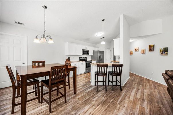 Chandelier, Dining room, Interior, Kitchen, Pendant Lights, Stainless Steel Appliances, Wood Texture Flooring