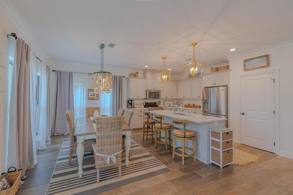 Chandelier, Dining room, Interior, Kitchen, Pendant Lights, Recessed Lighting, Stainless Steel Appliances, Wood Texture Flooring