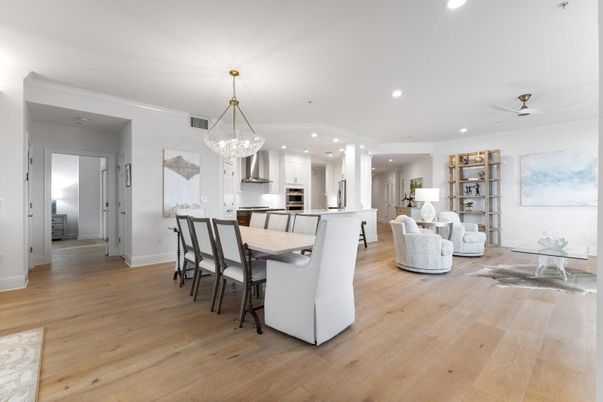 Chandelier, Dining room, Interior, Kitchen, Living room, Pendant Lights, Recessed Lighting, Stainless Steel Appliances, Wood Texture Flooring