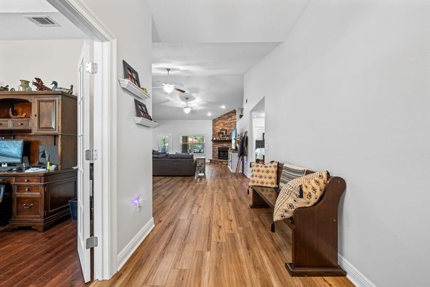 Fireplace, Interior, Living room, Recessed Lighting, Stone Walls, Wood Texture Flooring