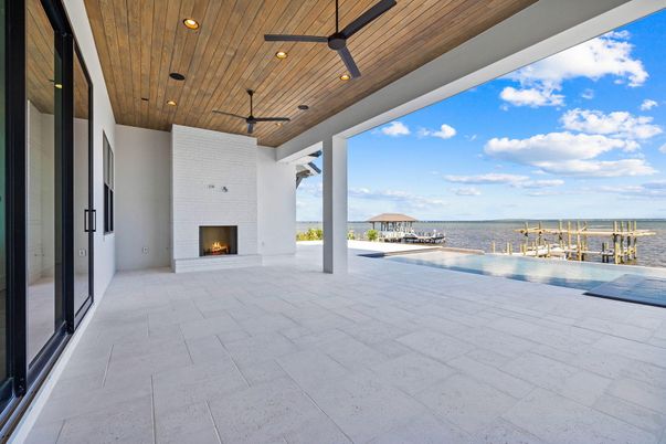 Empty room, Exterior, Fireplace, Recessed Lighting, Water, Wooden Ceilings