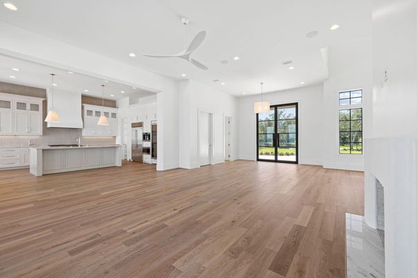 Chandelier, Empty room, Interior, Kitchen, Pendant Lights, Recessed Lighting, Stainless Steel Appliances, Wood Texture Flooring