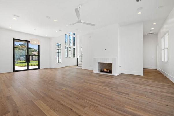 Chandelier, Empty room, Fireplace, Interior, Recessed Lighting, Wood Texture Flooring