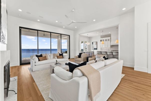Fireplace, Interior, Kitchen, Living room, Pendant Lights, Recessed Lighting, Water, Wood Texture Flooring