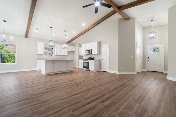 Empty room, Interior, Kitchen, Pendant Lights, Recessed Lighting, Stainless Steel Appliances, Wooden Beams, Wood Texture Flooring