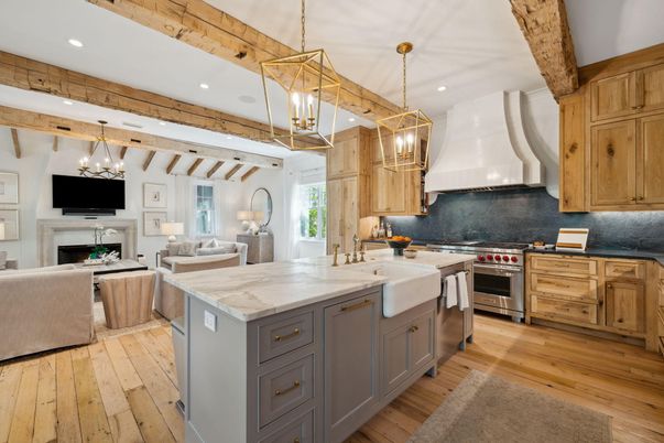 Chandelier, Fireplace, Interior, Kitchen, Living room, Pendant Lights, Recessed Lighting, Stainless Steel Appliances, Wooden Beams, Wood Texture Flooring