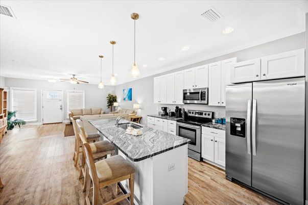 Dining room, Interior, Kitchen, Living room, Pendant Lights, Recessed Lighting, Stainless Steel Appliances, Wood Texture Flooring