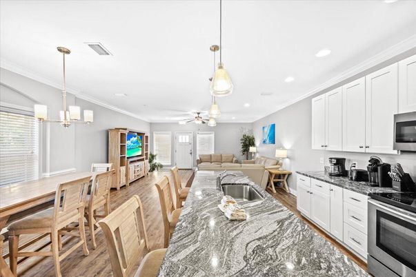 Dining room, Interior, Kitchen, Living room, Pendant Lights, Recessed Lighting, Stainless Steel Appliances, Wood Texture Flooring