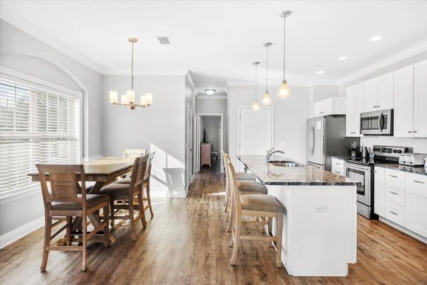 Chandelier, Dining room, Interior, Kitchen, Pendant Lights, Recessed Lighting, Stainless Steel Appliances, Wood Texture Flooring