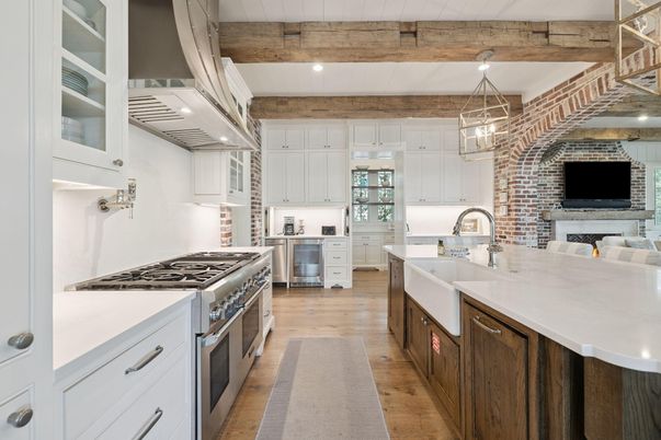 Fireplace, Interior, Kitchen, Pendant Lights, Recessed Lighting, Stainless Steel Appliances, Stone Walls, Wooden Beams, Wood Texture Flooring