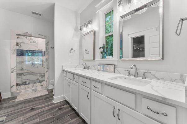 Bathroom, Dual Sink Vanities, Glass Shower, Interior, Marble Walls, Wood Texture Flooring