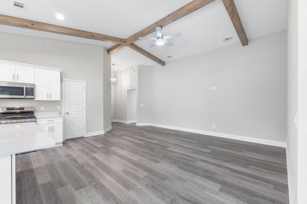 Empty room, Interior, Kitchen, Recessed Lighting, Stainless Steel Appliances, Wooden Beams, Wood Texture Flooring