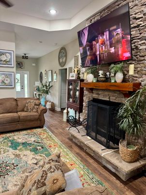 Fireplace, Interior, Living room, Recessed Lighting, Stone Walls, Wood Texture Flooring