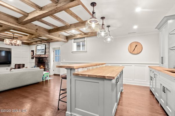 Chandelier, Fireplace, Interior, Kitchen, Living room, Pendant Lights, Recessed Lighting, Wooden Beams, Wood Texture Flooring