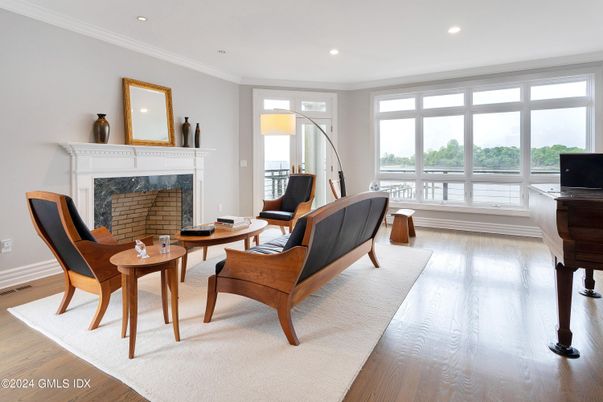 Fireplace, Interior, Living room, Piano, Recessed Lighting, Wood Texture Flooring
