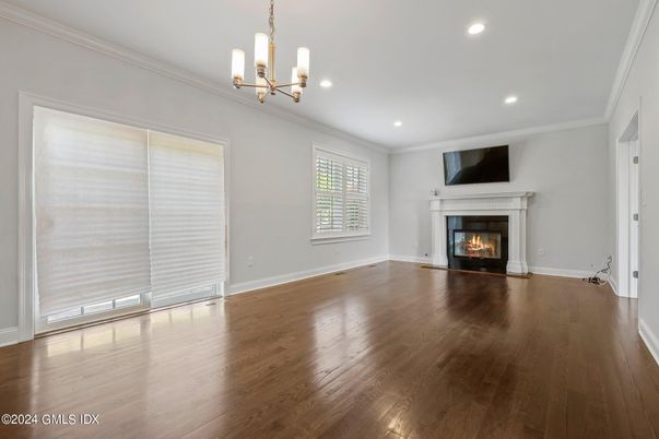 Chandelier, Empty room, Fireplace, Interior, Recessed Lighting, Wood Texture Flooring
