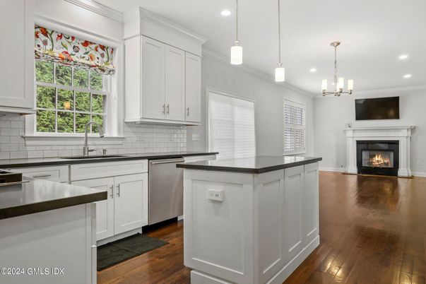 Fireplace, Interior, Kitchen, Pendant Lights, Recessed Lighting, Stainless Steel Appliances, Wood Texture Flooring