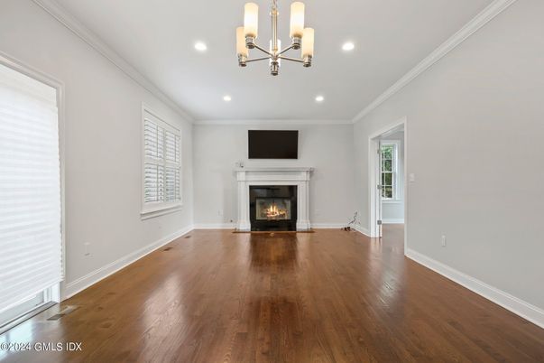Empty room, Fireplace, Interior, Pendant Lights, Recessed Lighting, Wood Texture Flooring