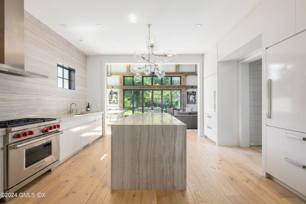 Chandelier, Interior, Kitchen, Living room, Pendant Lights, Recessed Lighting, Stainless Steel Appliances, Wood Texture Flooring
