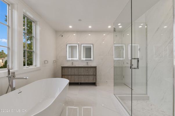 Bathroom, Dual Sink Vanities, Free Standing Baths, Glass Shower, Interior, Marble, Marble Walls, Recessed Lighting