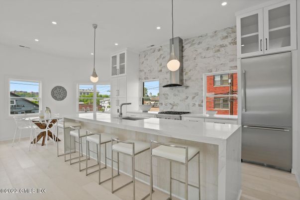 Dining room, Interior, Kitchen, Pendant Lights, Recessed Lighting, Stainless Steel Appliances, Wood Texture Flooring
