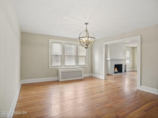 Chandelier, Empty room, Fireplace, Interior, Wood Texture Flooring