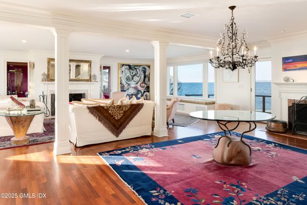 Chandelier, Fireplace, Interior, Living room, Recessed Lighting, Water, Wood Texture Flooring