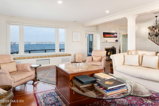 Chandelier, Fireplace, Interior, Living room, Recessed Lighting, Water, Wood Texture Flooring
