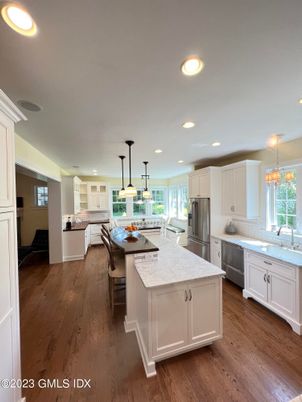 Dining room, Interior, Kitchen, Pendant Lights, Recessed Lighting, Stainless Steel Appliances, Wood Texture Flooring