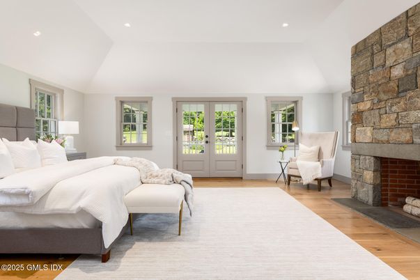 Bedroom, Fireplace, Interior, Recessed Lighting, Stone Walls, Wood Texture Flooring