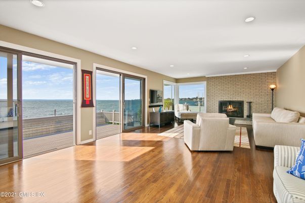 Fireplace, Interior, Living room, Recessed Lighting, Stone Walls, Water, Wood Texture Flooring