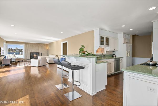 Fireplace, Interior, Kitchen, Living room, Recessed Lighting, Stone Walls, Wood Texture Flooring