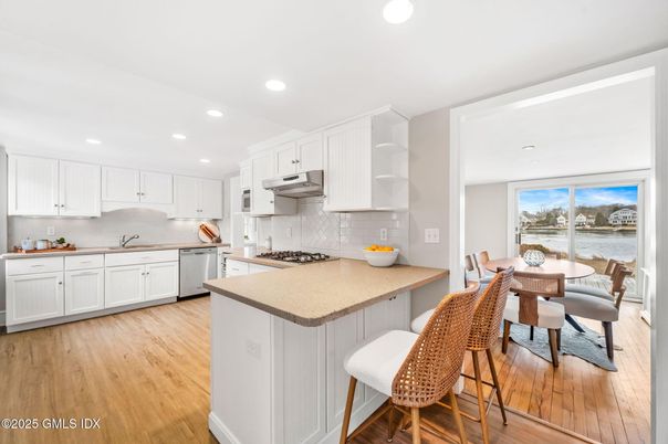 Dining room, Interior, Kitchen, Recessed Lighting, Stainless Steel Appliances, Wood Texture Flooring