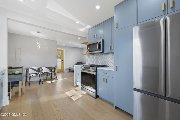 Dining room, Interior, Kitchen, Pendant Lights, Recessed Lighting, Stainless Steel Appliances, Wood Texture Flooring