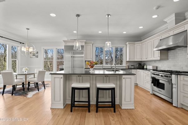 Dining room, Interior, Kitchen, Pendant Lights, Recessed Lighting, Stainless Steel Appliances, Wood Texture Flooring