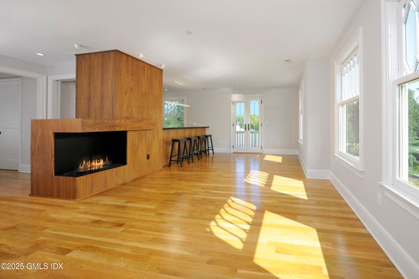 Empty room, Fireplace, Interior, Pendant Lights, Recessed Lighting, Wood Texture Flooring